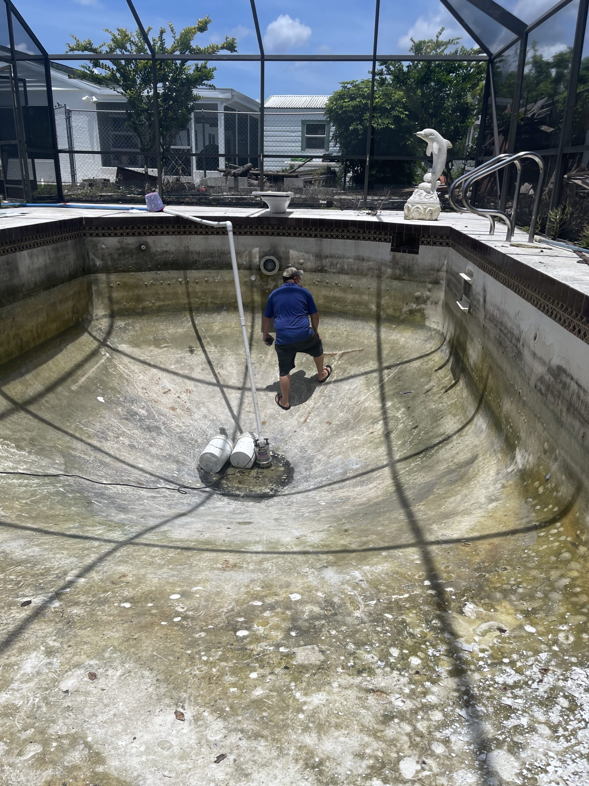 A man cleaning a pool